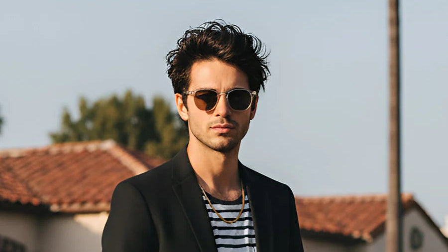 Man wearing sunglasses with a blurred background